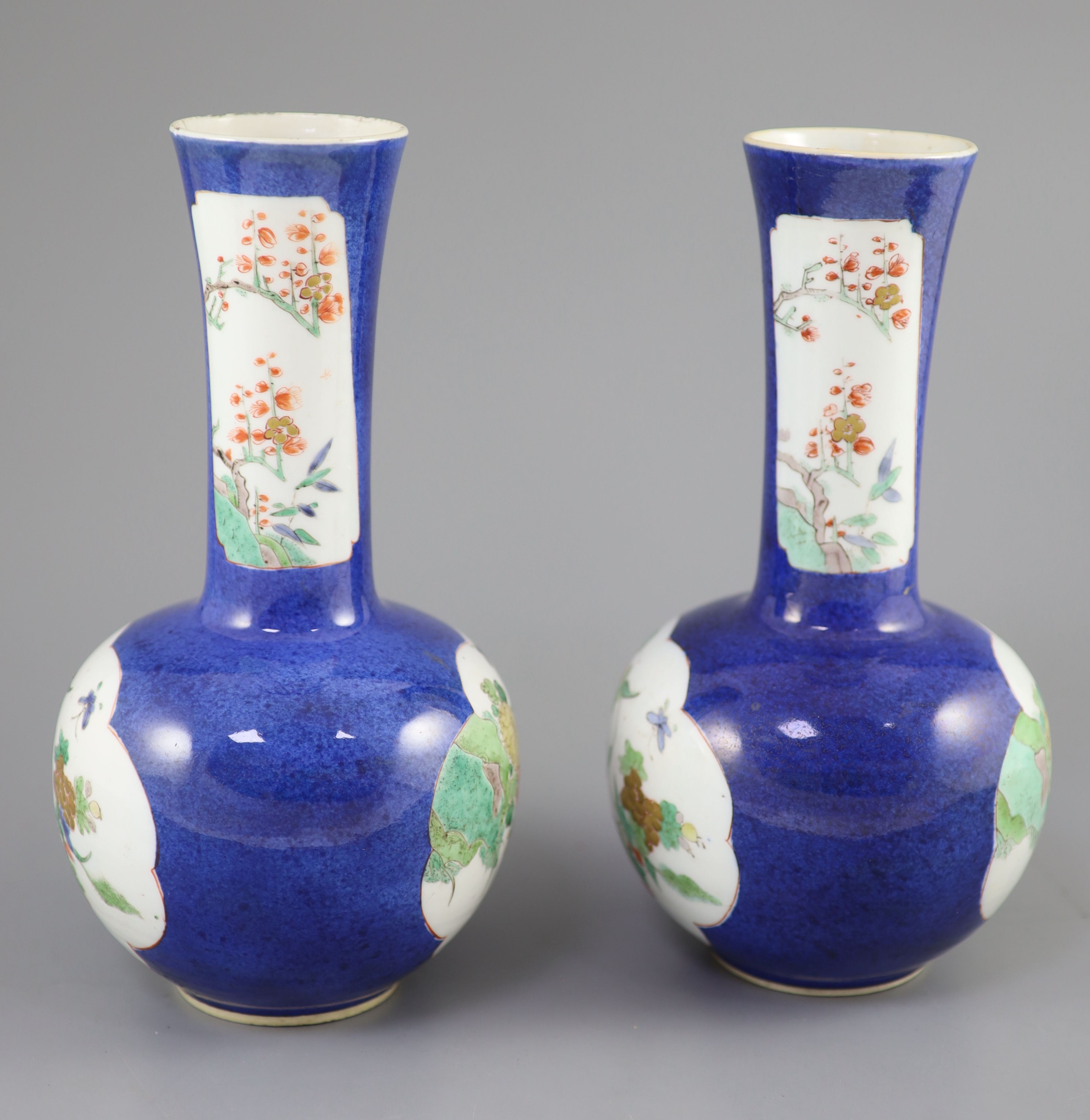 A pair of Chinese powder blue famille verte bottle vases, Kangxi period (1662-1722), 26cm high